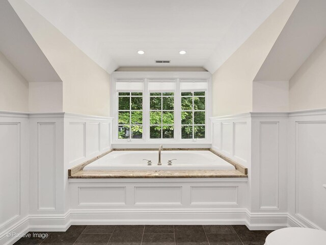 1360 Turvey Rd, Downers Grove, IL 60515 - bathroom featuring a decorative wall, a garden tub, wainscoting, and tile patterned flooring