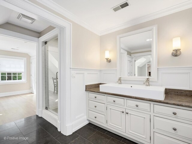 1360 Turvey Rd, Downers Grove, IL 60515 - full bath featuring a decorative wall, vanity, a stall shower, wainscoting, and ornamental molding