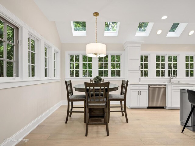 1360 Turvey Rd, Downers Grove, IL 60515 - dining space featuring a skylight, light wood-type flooring, recessed lighting, and vaulted ceiling