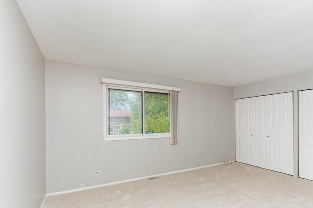 2265 Windsor Ln, Country Club Hills, IL 60478 - unfurnished bedroom with light carpet and baseboards