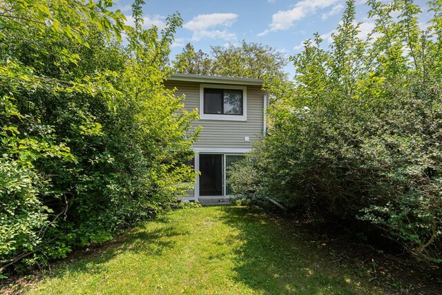 2265 Windsor Ln, Country Club Hills, IL 60478 - rear view of house with a lawn