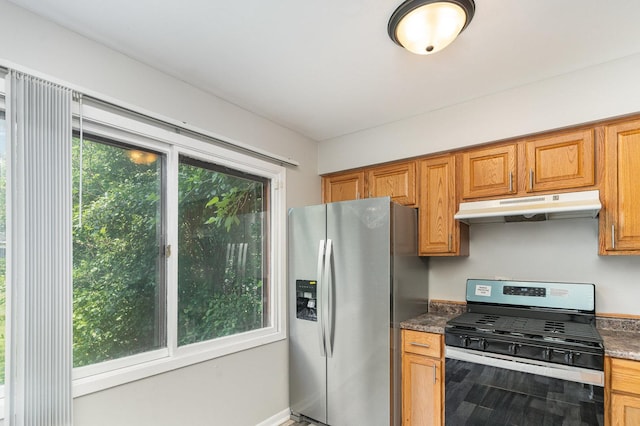 2265 Windsor Ln, Country Club Hills, IL 60478 - kitchen featuring appliances with stainless steel finishes, under cabinet range hood, brown cabinetry, dark countertops, and baseboards