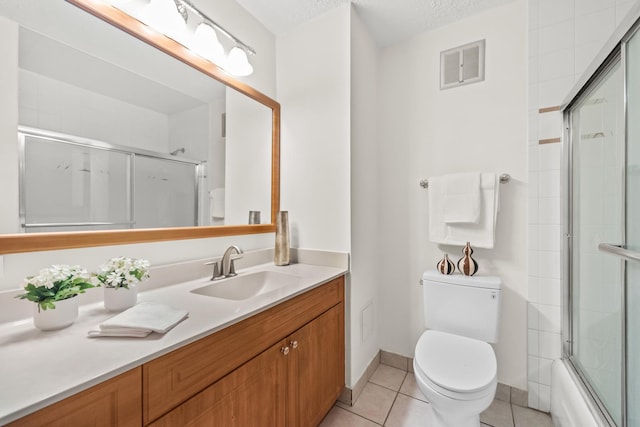 4170 N Marine Dr Unit 6L, Chicago, IL 60613 - full bath with toilet, vanity, tile patterned flooring, baseboards, and enclosed tub / shower combo