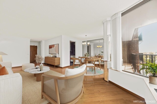 4170 N Marine Dr Unit 6L, Chicago, IL 60613 - living area with a chandelier and light wood-type flooring