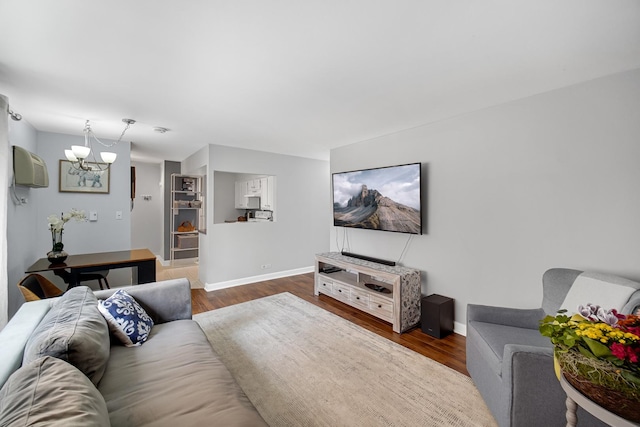 7830 W N Ave Unit 306, Elmwood Park, IL 60707 - living area with dark wood-type flooring, a chandelier, and baseboards
