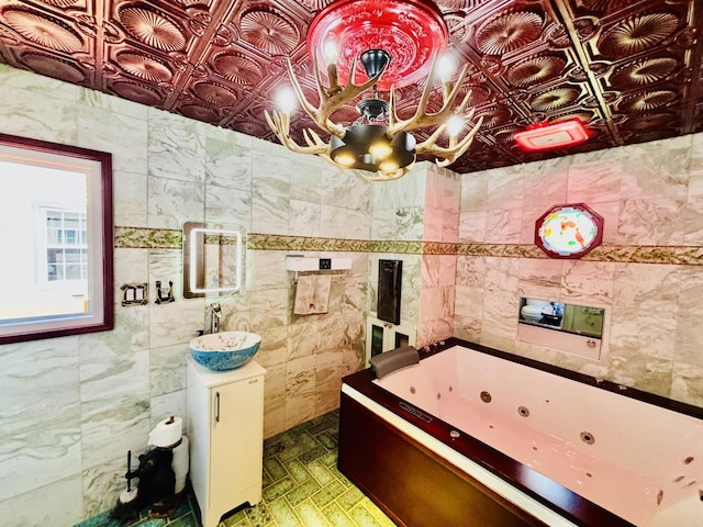 3515 Union Ave, Steger, IL 60475 - full bathroom with tile walls, a jetted tub, an ornate ceiling, and vanity