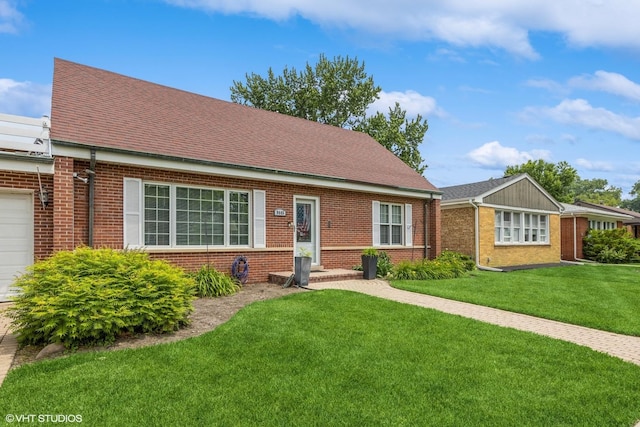 9445 Le Claire Ave, Skokie, IL 60077 - view of front of home with a front yard, brick siding, and a shingled roof