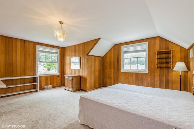 9445 Le Claire Ave, Skokie, IL 60077 - bedroom with multiple windows, wood walls, a chandelier, carpet flooring, and vaulted ceiling