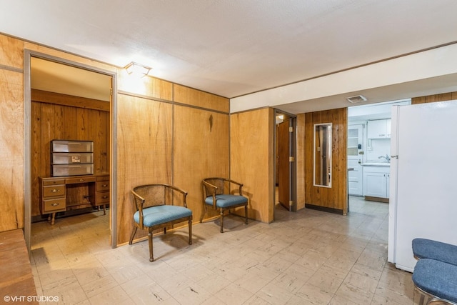 9445 Le Claire Ave, Skokie, IL 60077 - living area with light flooring and wood walls