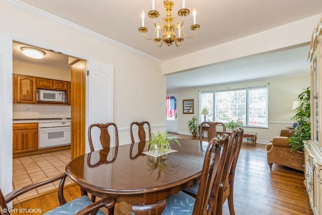 9445 Le Claire Ave, Skokie, IL 60077 - dining room with a chandelier, ornamental molding, and light wood finished floors