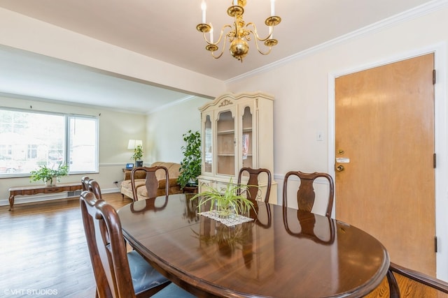 9445 Le Claire Ave, Skokie, IL 60077 - dining room with a chandelier, wood finished floors, and crown molding
