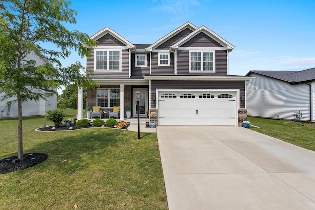 1607 Peppermill Ln, Champaign, IL 61822 - craftsman-style house featuring concrete driveway, a front lawn, a garage, brick siding, and covered porch