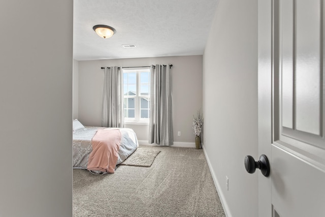 1607 Peppermill Ln, Champaign, IL 61822 - carpeted bedroom with baseboards and a textured ceiling