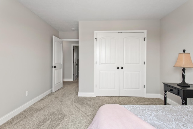 1607 Peppermill Ln, Champaign, IL 61822 - carpeted bedroom with baseboards and a closet