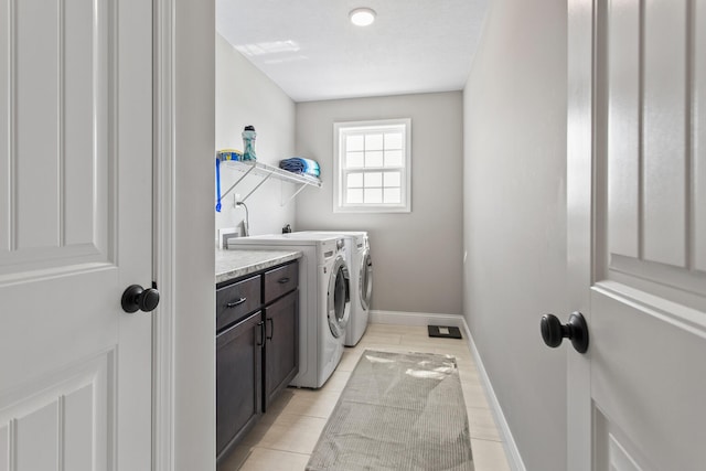 1607 Peppermill Ln, Champaign, IL 61822 - laundry area featuring washer and clothes dryer, cabinet space, and light tile patterned floors