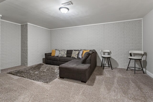 1607 Peppermill Ln, Champaign, IL 61822 - living area featuring brick wall, carpet floors, and crown molding