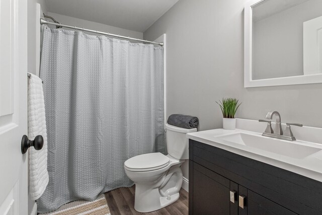 1607 Peppermill Ln, Champaign, IL 61822 - bathroom featuring wood finished floors, vanity, and a shower with shower curtain