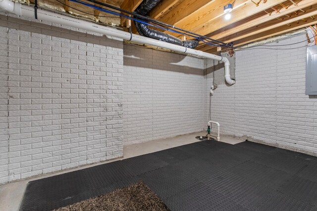 1607 Peppermill Ln, Champaign, IL 61822 - unfinished basement with brick wall and electric panel