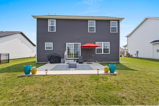 1607 Peppermill Ln, Champaign, IL 61822 - rear view of property with a patio area and a lawn