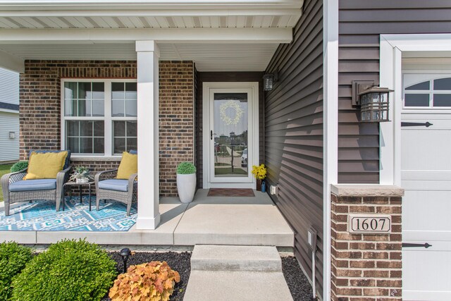 1607 Peppermill Ln, Champaign, IL 61822 - view of exterior entry with covered porch and brick siding