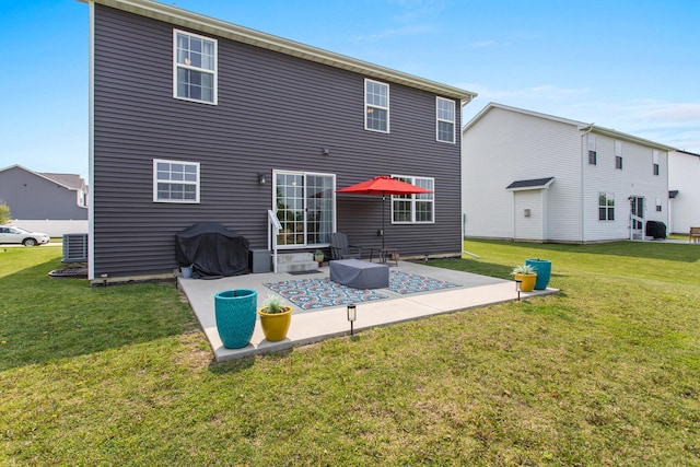 1607 Peppermill Ln, Champaign, IL 61822 - rear view of property with a patio area and a lawn