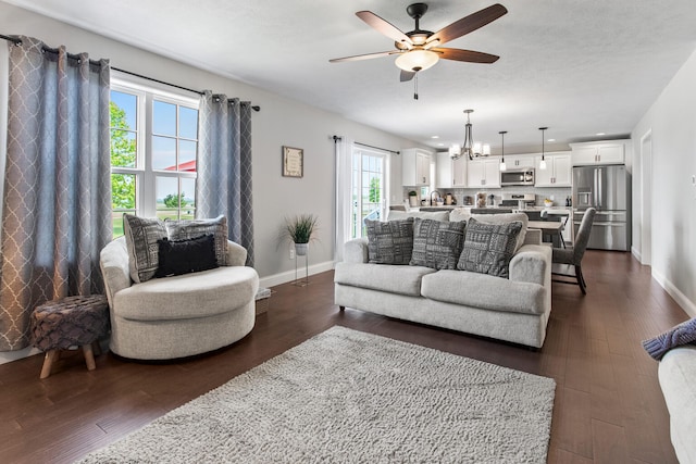 1607 Peppermill Ln, Champaign, IL 61822 - living room featuring ceiling fan, dark wood-type flooring, and a chandelier