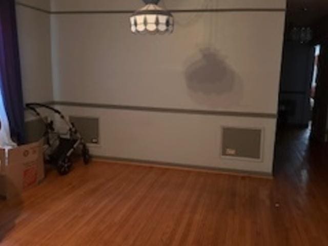 unfurnished dining area featuring light wood-style flooring and baseboards