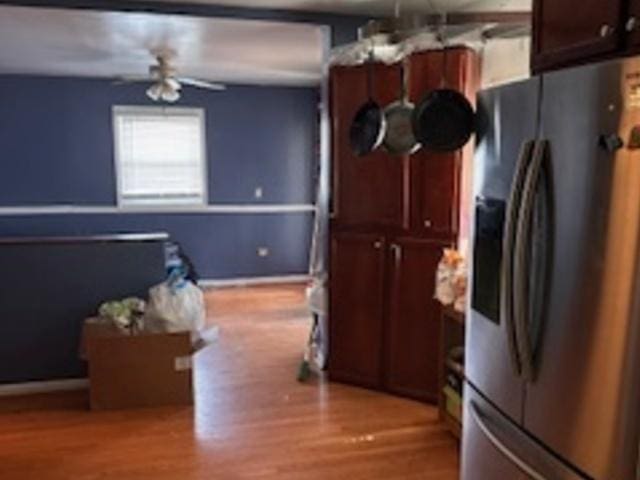 kitchen with stainless steel fridge, ceiling fan, and light wood-type flooring