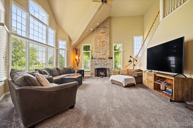 36W850 Red Gate Ct, Saint Charles, IL 60175 - carpeted living area featuring ceiling fan, a towering ceiling, and a stone fireplace