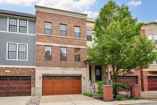 17 Virginia Pkwy, Schaumburg, IL 60193 - townhome / multi-family property with brick siding, a garage, and concrete driveway