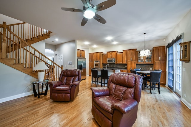 17 Virginia Pkwy, Schaumburg, IL 60193 - living area with stairs, light wood-style floors, baseboards, and ceiling fan