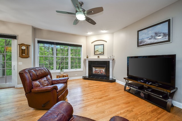 17 Virginia Pkwy, Schaumburg, IL 60193 - living area featuring wood finished floors, baseboards, a fireplace, and a ceiling fan
