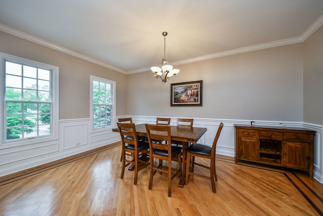 17 Virginia Pkwy, Schaumburg, IL 60193 - dining room featuring a chandelier, ornamental molding, light wood-style floors, and wainscoting