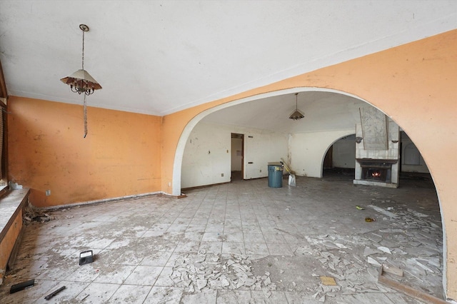 9033 Winn Rd, Spring Grove, IL 60081 - miscellaneous room with arched walkways and a warm lit fireplace