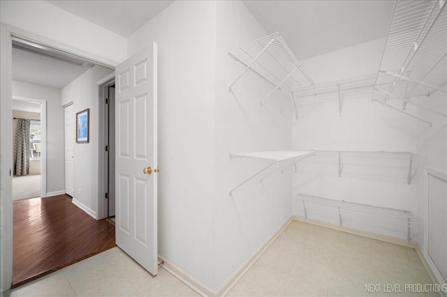 211 Trentt Dr Unit 211, Batavia, IL 60510 - walk in closet featuring tile patterned floors