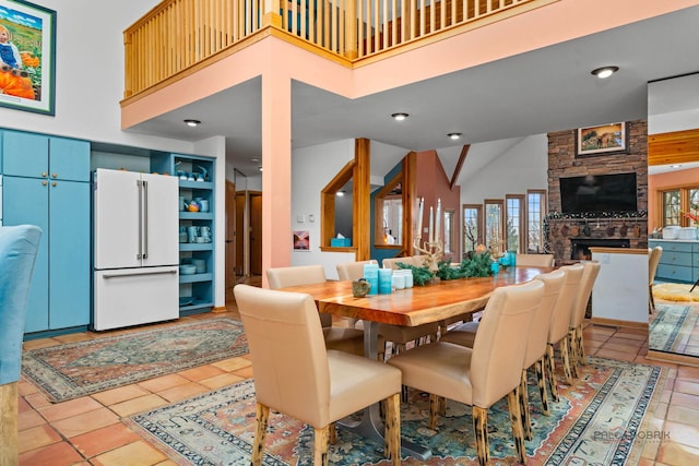 20719 Highview Rd, Marengo, IL 60152 - dining area featuring high vaulted ceiling, light tile patterned flooring, and a fireplace