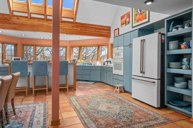 20719 Highview Rd, Marengo, IL 60152 - kitchen featuring white appliances, plenty of natural light, light tile patterned floors, open shelves, and recessed lighting