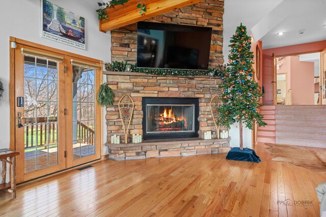 20719 Highview Rd, Marengo, IL 60152 - unfurnished living room with hardwood / wood-style floors, beam ceiling, and a fireplace
