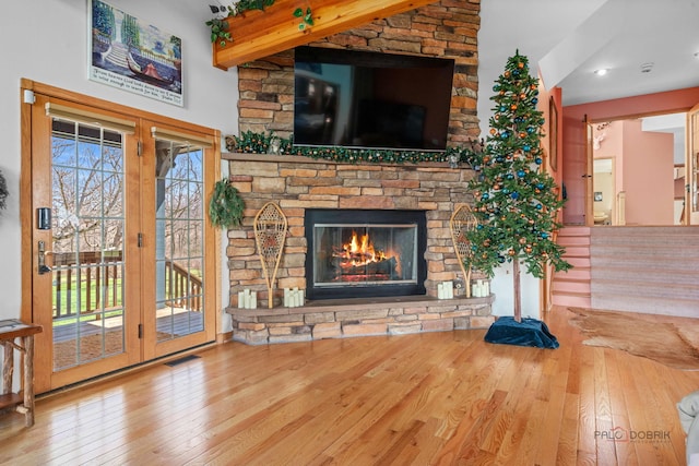 20719 Highview Rd, Marengo, IL 60152 - unfurnished living room with hardwood / wood-style floors, beam ceiling, and a stone fireplace