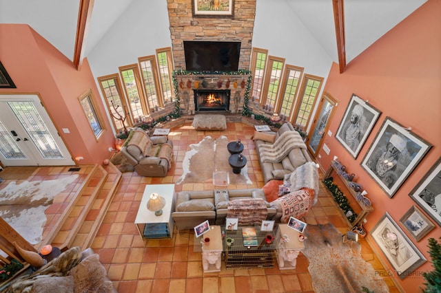 20719 Highview Rd, Marengo, IL 60152 - living room with high vaulted ceiling, a stone fireplace, tile patterned flooring, french doors, and beamed ceiling