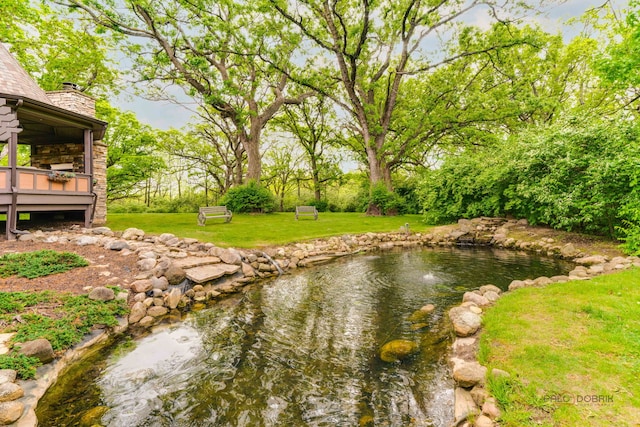 20719 Highview Rd, Marengo, IL 60152 - view of grassy yard with a garden pond and a deck