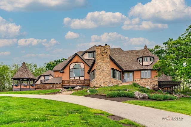 20719 Highview Rd, Marengo, IL 60152 - tudor home with stone siding, a gazebo, a front yard, a chimney, and french doors