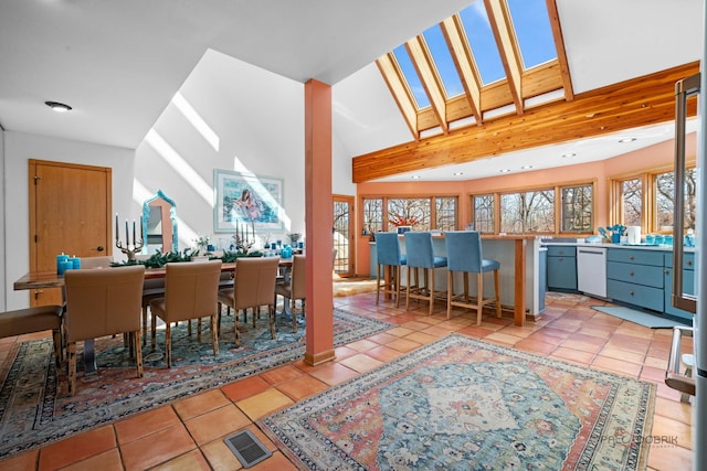 20719 Highview Rd, Marengo, IL 60152 - dining space with recessed lighting, a skylight, light tile patterned floors, and a high ceiling