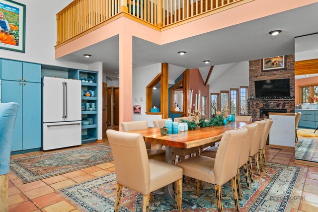 20719 Highview Rd, Marengo, IL 60152 - dining room with high vaulted ceiling, light tile patterned floors, and a stone fireplace