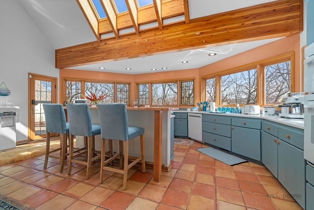 20719 Highview Rd, Marengo, IL 60152 - kitchen with a skylight, healthy amount of natural light, a kitchen breakfast bar, high vaulted ceiling, and recessed lighting