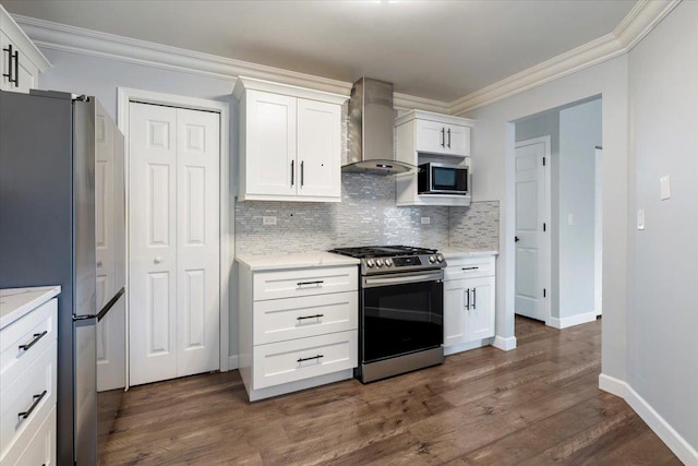 1300 Woodside Ct Unit B2, Schaumburg, IL 60193 - kitchen featuring appliances with stainless steel finishes, wall chimney range hood, ornamental molding, backsplash, and dark wood finished floors