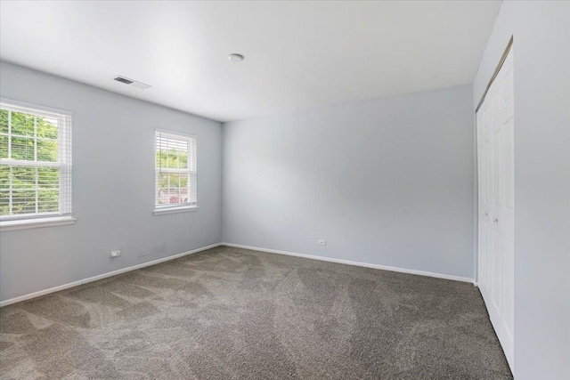 1300 Woodside Ct Unit B2, Schaumburg, IL 60193 - unfurnished room with carpet floors, healthy amount of natural light, and baseboards