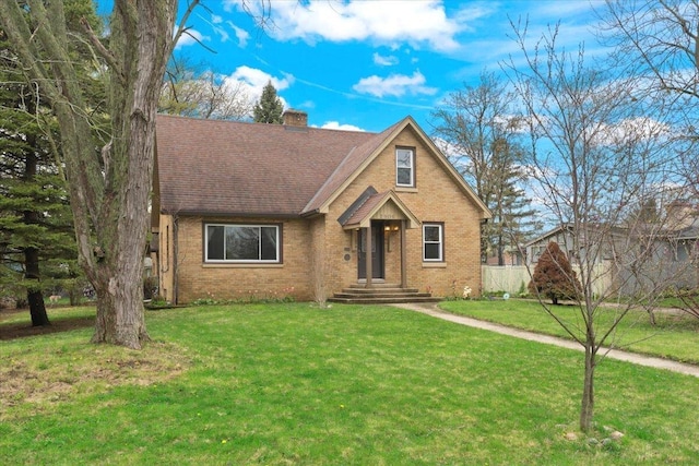 2906 Bethel Blvd, Zion, IL 60099 - view of front facade with brick siding, a chimney, and a front lawn