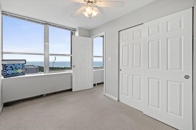 655 W Irving Park Rd Unit 4212, Chicago, IL 60613 - unfurnished bedroom with carpet, a water view, multiple windows, and ceiling fan