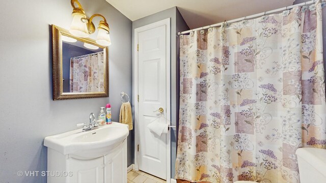 316 Juliana Ln, Bloomingdale, IL 60108 - bathroom with vanity, toilet, tile patterned floors, and a shower with shower curtain
